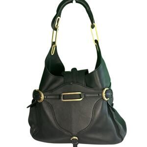 Jimmy Choo. Black leather with gold trim.  Excellent condition